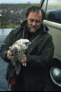 Bobby Tulloch holding a Gyrfalcon